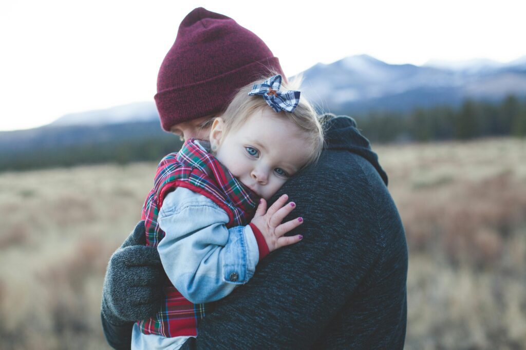 A parent holding a child. Encouraging healing someone with a  disorganized attachment style.